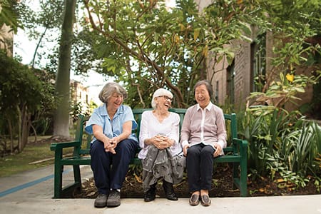 Home 2 Front Porch Community Members On Bench